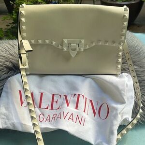 Beige Valentino stud purse a few small spots inside looks like lipstick